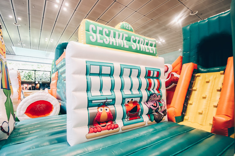 Photo spot, rock climbing wall and tunnel in the Sesame Street inflatable playground
